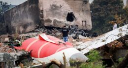 A fire officer stands next to the crashed Air India Boeing 787-8 Dreamliner aircraft, in Ahmedabad, India, June 13