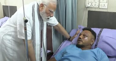 Briton Vishwash Kumar Ramesh, 40, miraculously survived the plane disaster. Pictured: Prime Minister Narendra Modi (L) meeting with Vishwash Kumar Ramesh in an Ahmedabad hospital on Friday