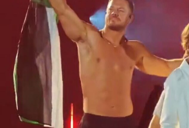 Imagine Dragons is facing backlash after frontman Dan Reynolds (pictured) waved a Palestinian flag on stage during a recent concert in Milan