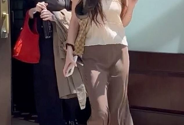 Dakota Johnson appeared downcast as she surfaced in New York this Wednesday, hours before DailyMail.com confirmed her split from Chris Martin