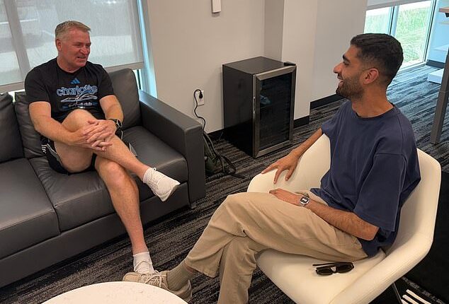 Dean Smith (left) speaks to Mail Sport's Aadam Patel in his office in Charlotte