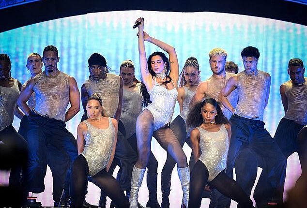Dua Lipa set Wembley alight as she shocked fans by bringing Charli XCX as her special guest on stage during the second night of her sold-out stadium show on Saturday