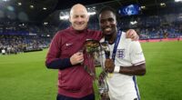 Jonathan Rowe poses with the UEFA Under-21 Championship with head coach Lee Carsley