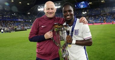 Jonathan Rowe poses with the UEFA Under-21 Championship with head coach Lee Carsley