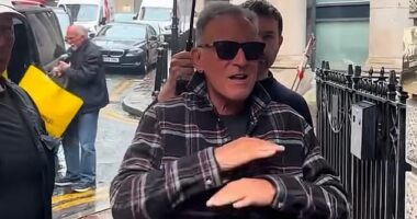 Bruce Springsteen looked furious as he refused to sign autographs for fans waiting in the rain in Manchester