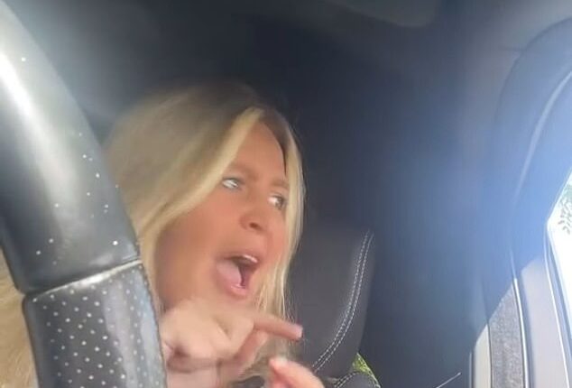 The motorist, who was 'literally shaking', spoke angrily to camera asking whether she was 'in the wrong'