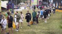 Long queues for the showers at Glastonbury Festival at Worthy Farm in Somerset this morning