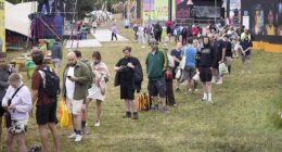 Long queues for the showers at Glastonbury Festival at Worthy Farm in Somerset this morning