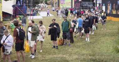 Long queues for the showers at Glastonbury Festival at Worthy Farm in Somerset this morning