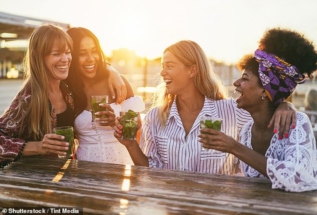A young group of friends pictured enjoying a beverage (stock image)