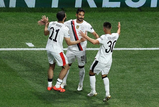 Ilkay Gundogan pictured (centre) celebrating with his Manchester City team-mates after scoring against Abu Dhabi side Al Ain at the FIFA Club World Cup on Sunday night