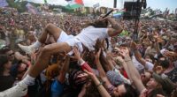 Bob Vylan crowdsurfs in front of the West Holts stage during day four of Glastonbury festival