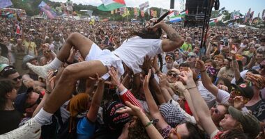Bob Vylan crowdsurfs in front of the West Holts stage during day four of Glastonbury festival