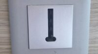 The British hotel guest posted a photo of a wall plate featuring a small rectangular opening marked with the word 'Legrand' and asked: 'What is this thing?'
