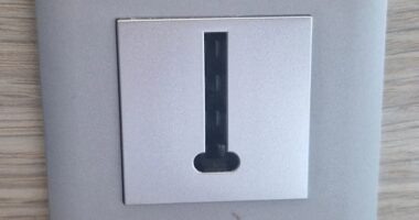 The British hotel guest posted a photo of a wall plate featuring a small rectangular opening marked with the word 'Legrand' and asked: 'What is this thing?'