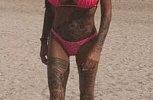 Katie Price pranced across the beach in Dubai on Monday