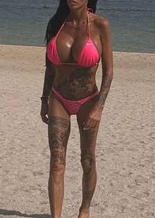 Katie Price pranced across the beach in Dubai on Monday