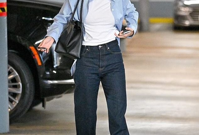 Kendall Jenner, 29, looked effortlessly chic in denim and a striped shirt as she was spotted heading to a solo sushi dinner in West Hollywood on Thursday