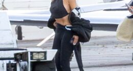 Kim Kardashian put her impossibly tiny waist on display again in another eye-catching look