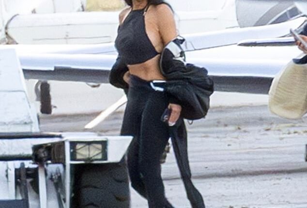 Kim Kardashian put her impossibly tiny waist on display again in another eye-catching look