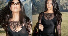 Kourtney Kardashians rocks sheer lace mini dress