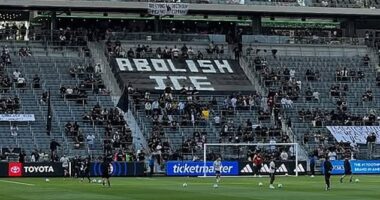 Fans are seen unfurling an Abolish ICE banner prior to Sunday's game against Kansas City