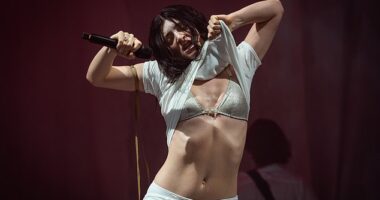 Lorde sent fans into a frenzy with a surprise performance at Glastonbury on Friday morning, which saw her whip her top off in the sweltering heat