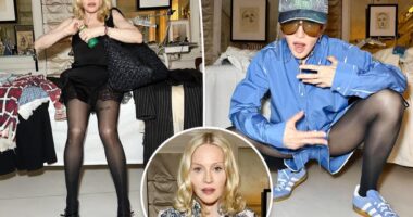 Madonna models a dozen outfits, including one demure Dior dress