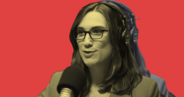 Sarah McBride speaking into a mic