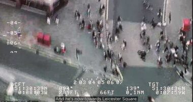 The dramatic moment an alleged phone thief on an e-bike cuts through a crowd of pedestrians in Piccadilly Circus as he tries to outrun police