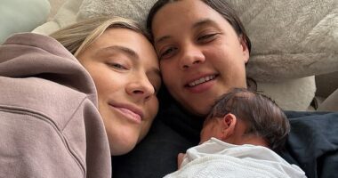 Sam Kerr (pictured with fiancee Kristie Mewis and their baby boy Jagger) is fighting to be fit - and to retain her old position as Matildas skipper