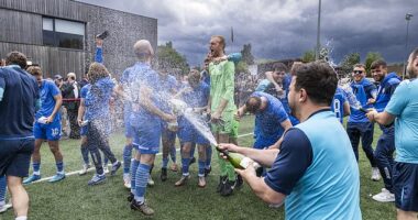 Musselburgh players are soaked in champagne, or some other kind of cheap fizz, at full-time
