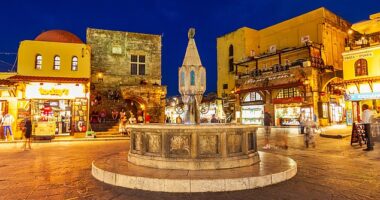 Sunset in the main square in Rhodes' Old Town is a tourist favourite...but holidaymakers have warned it can also leaver drinkers out of pocket, as bars inflate prices