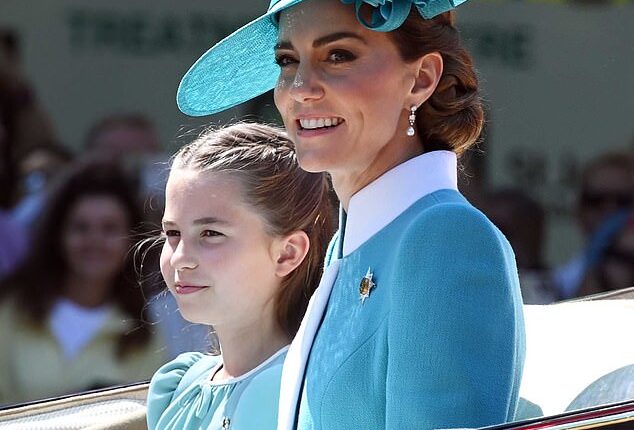 Charlotte took after her mother as they wore matching blue dresses, with Kate picking a blue coat dress from Catherine Walker - complete with a wide-brimmed hat by Juliette Botterill - for today's Trooping the Colour.