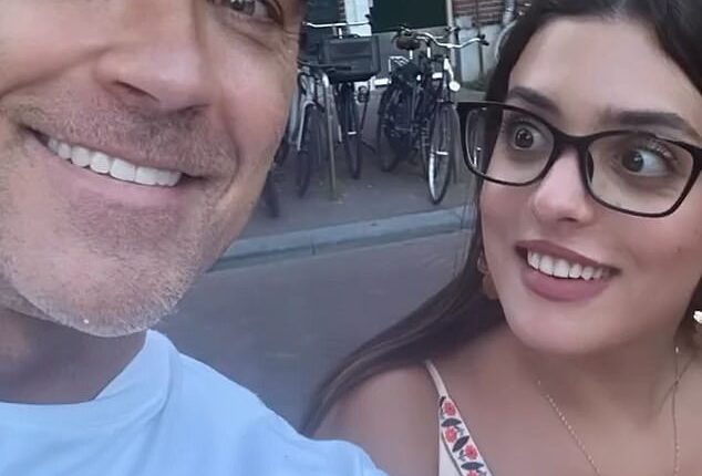 Robbie Williams baffled strangers by asking them for selfies as he strolled around Amsterdam over the weekend in a clip shared on Instagram on Sunday