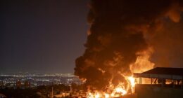 Gas prices at the pump are expected to rise a further five cents per gallon as the aftershock of US missile strikes in Iran continue to rock the stock market. (Pictured: Fire and smoke rise into the sky after an Israeli attack on the Shahran oil depot on June 15, 2025 in Tehran)