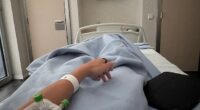 She posted a photo of her watching Spain's 3-1 victory from a hospital bed with a cannula in