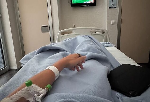 She posted a photo of her watching Spain's 3-1 victory from a hospital bed with a cannula in