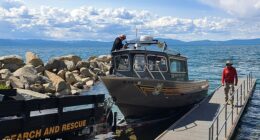 The two survivors of the deadly Lake Tahoe tragedy that claimed eight lives were wearing life jackets at the time of their rescue (pictured: search-and-rescue teams on Lake Tahoe)