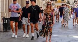 Sydney Sweeney was spotted enjoying a stroll through the sun-soaked streets of Venice with Orlando Bloom (centre) and Tom Brady (left) on Saturday