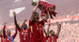 Robertson celebrates winning the Premier League for the second time with Liverpool