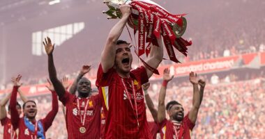 Robertson celebrates winning the Premier League for the second time with Liverpool