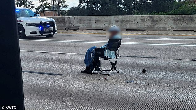 Multiple law enforcement agencies are Interstate 45 trying to negotiate with the woman, who pulled a folding chair out of her car and has been sitting in the middle of the road