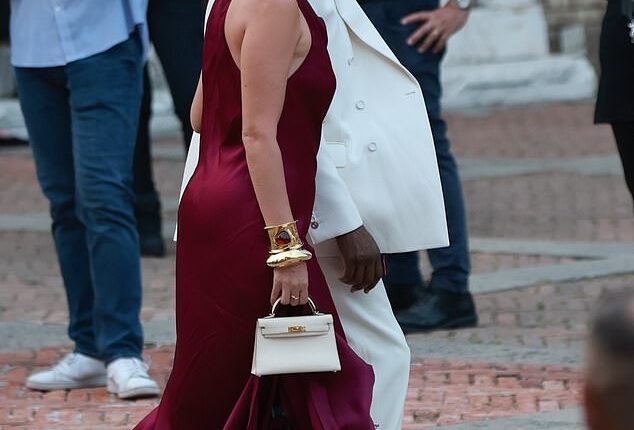 Usher and his wife Jenn Goicoechea looked effortlessly elegant as they entered the wedding, with the R&B star wearing a white tux while his wife donned a stunning burgundy gown