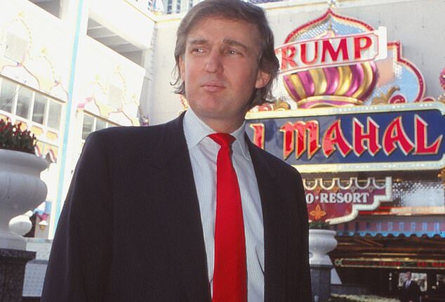 Donald Trump stands in front of Taj Mahal Casino Hotel in Atlantic City, New Jersey, in 1990