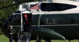 After exiting Marine One last Saturday evening, President Donald Trump – donning a red MAGA cap and signature blue suit and red tie – walked across the South Lawn glancing up briefly to acknowledge the assembled media but declining to answer their shouted questions.