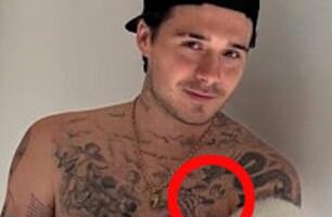 Brooklyn Beckham, 26, recently revealed he has savagely covered up a 'mama's boy' tattoo on his chest in tribute to Victoria (pictured in February