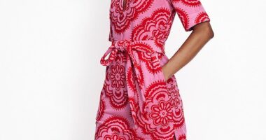 Boden¿s notch-collared towelling dress (£98, boden.com) with elbow-length sleeves and a side split in a pink and red tile print is a classy alternative to the classic beach cover up