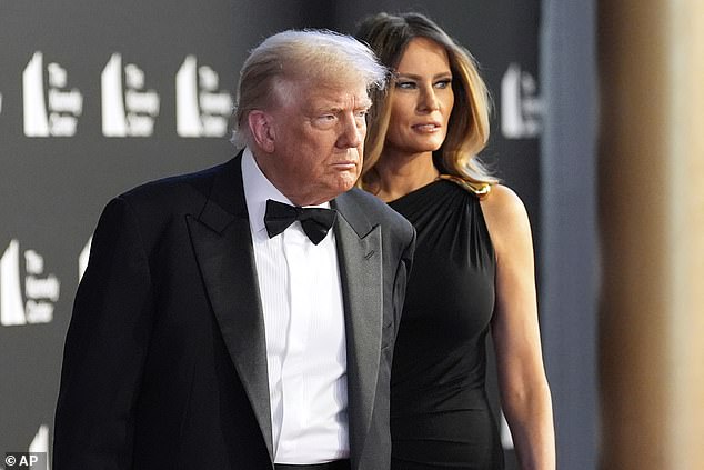 President Donald Trump (left) walking the red carpet with first lady Melania Trump (right) at the Kennedy Center Wednesday night. He struck a defiant tone when asked about some of Les Miserables' cast member boycotting his appearance