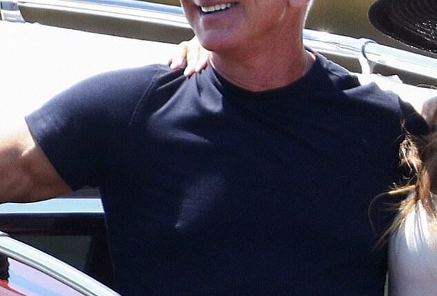 Jeff Bezos, 61, continued with his understated ensembles today in a lackluster combination of a tight black T-shirt and light grey pants for his water taxi journey around the Venetian canals with his new bride